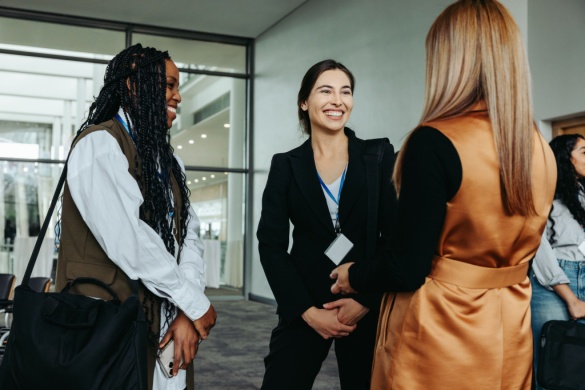 Three women meet at a conference